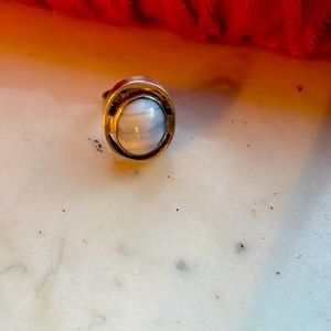 Heavy silver tin with stone that has blue highlights